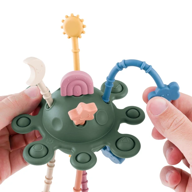 PETITE&MARS Silikonowa zabawka sensoryczna Crazy planet Misty Green (1).jpg